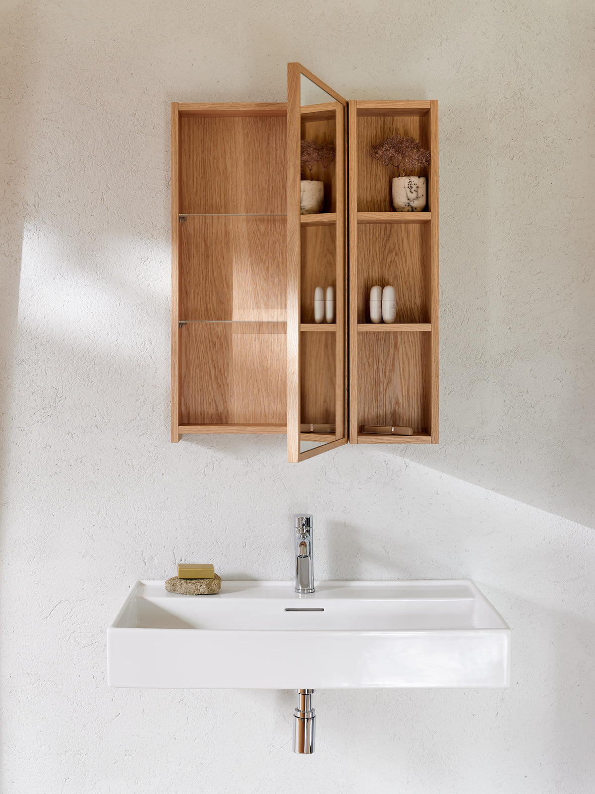 Open oak bathroom cabinet with shelves in a modular bathroom furniture composition