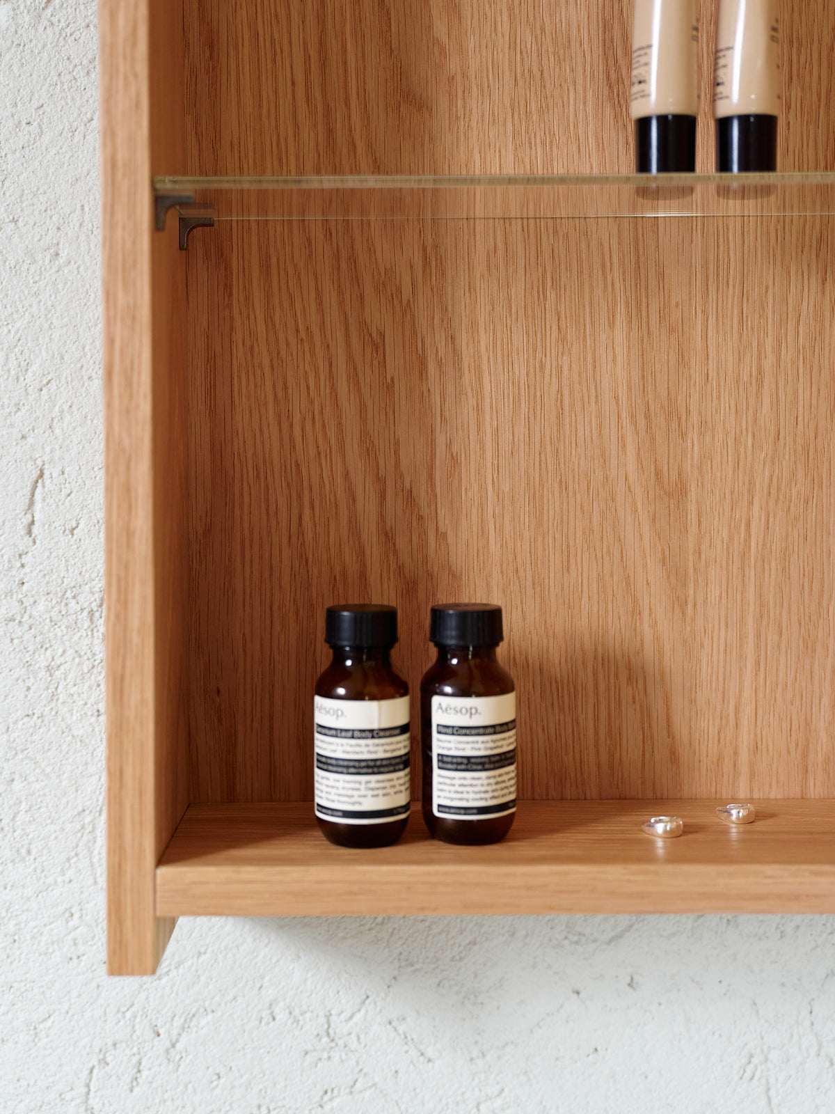 Natural oak bathroom mirror cabinet interior with adjustable glass shelf