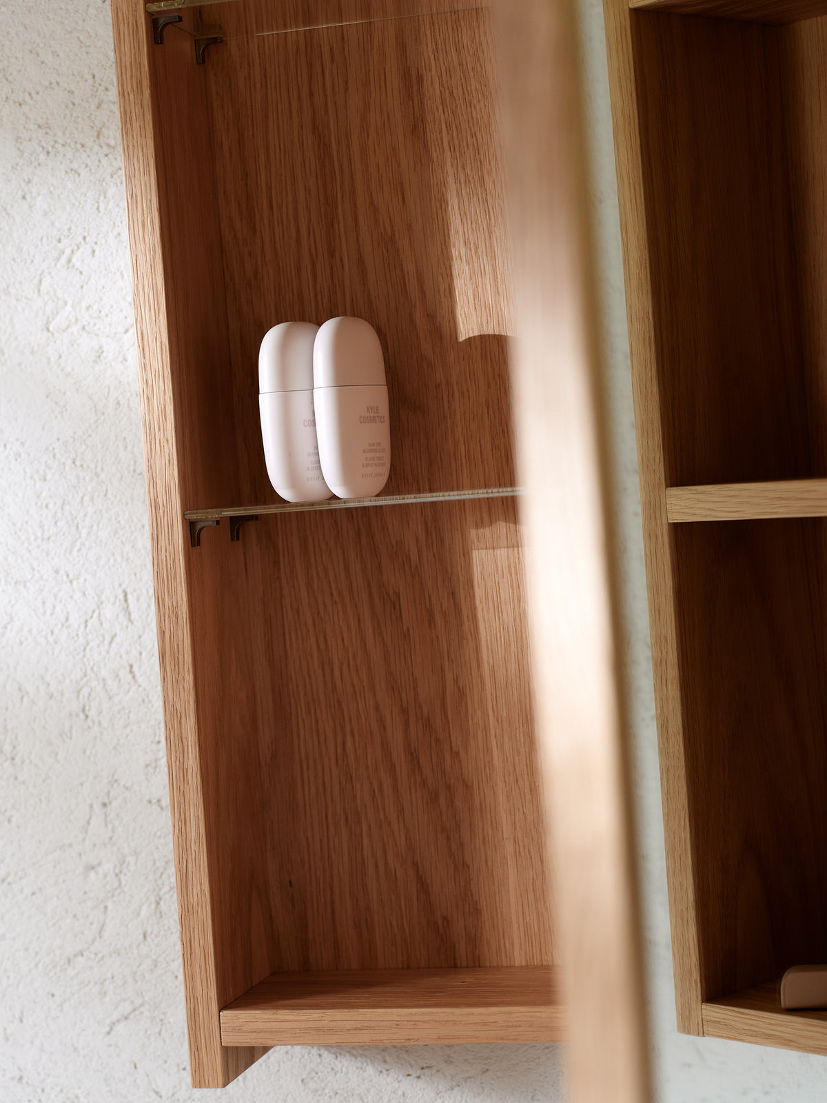 Natural oak bathroom mirror cabinet detail showing the solid oak frame and wood grain