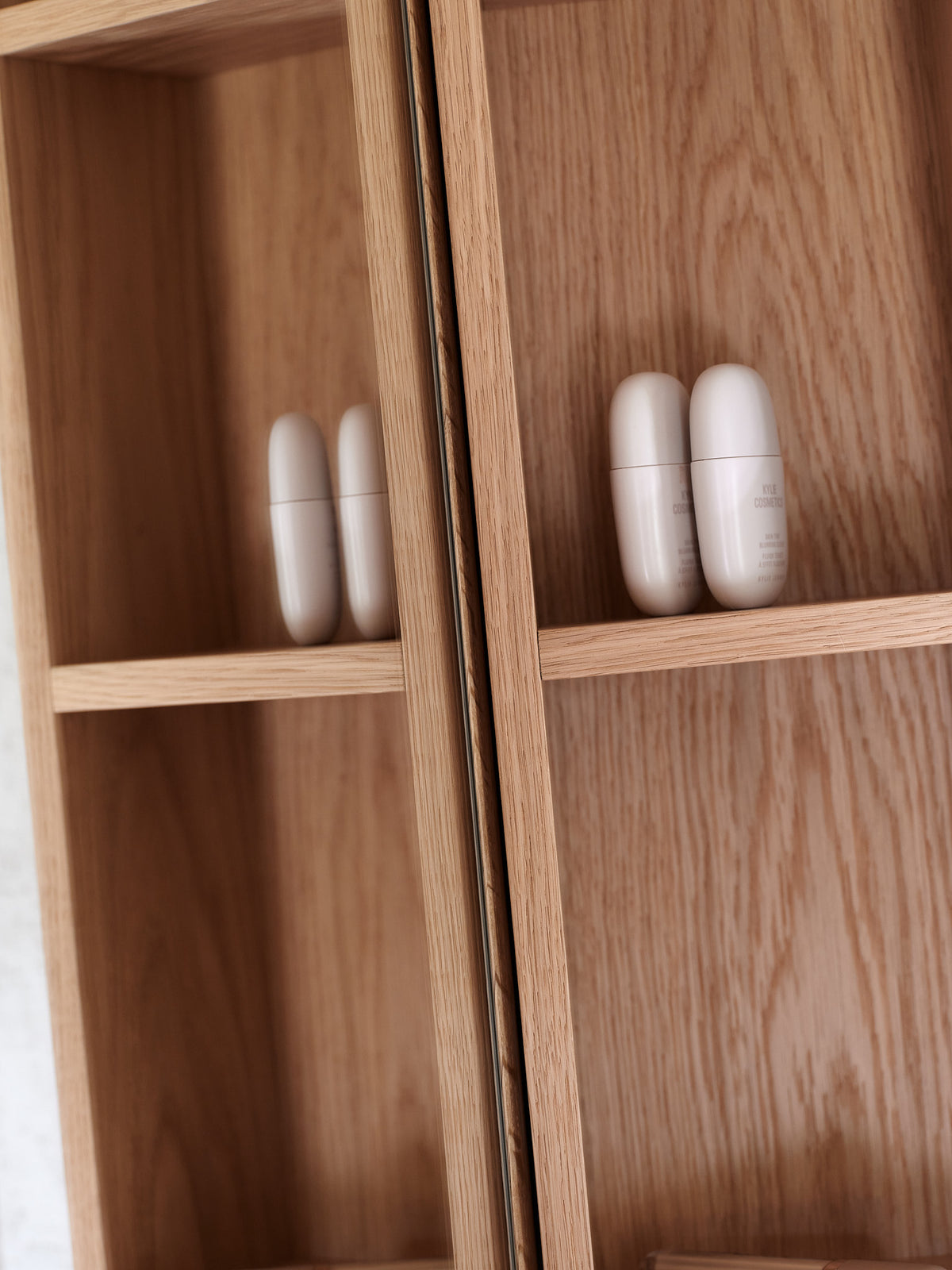 Natural oak bathroom open cabinet detail showing the solid oak frame and wood grain